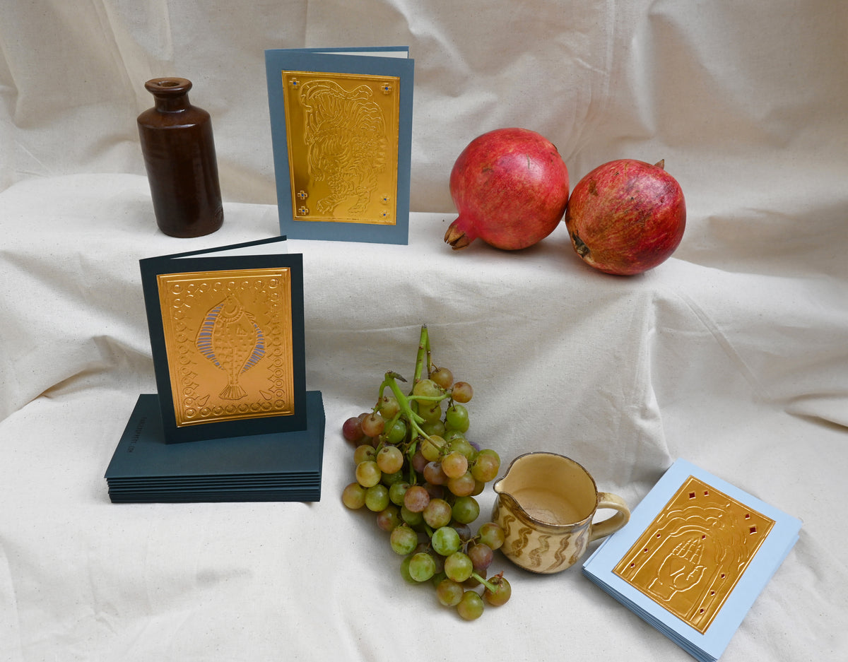 A collection of 3 greeting card by Fabler's Press. Tiger, fish and hand design surrounded by ancient looking pots and ceramics, pomegranates and a bunch of green blushing grapes. reminiscent of a Venetian still life on a back drop of cream canvas.