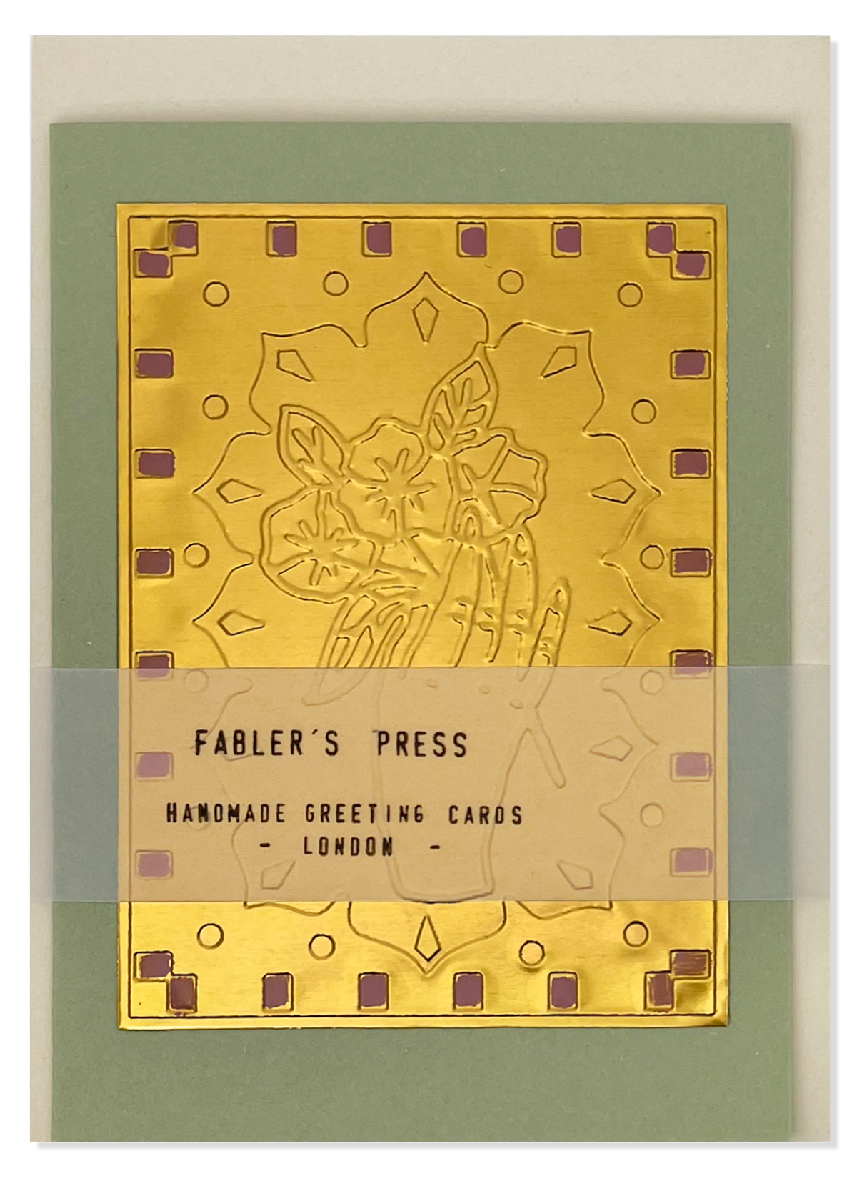 A handmade greeting card from Fabler's Press, featuring a gold foil embossed floral design on a sage green card stock background with a translucent wrap label across the centre.