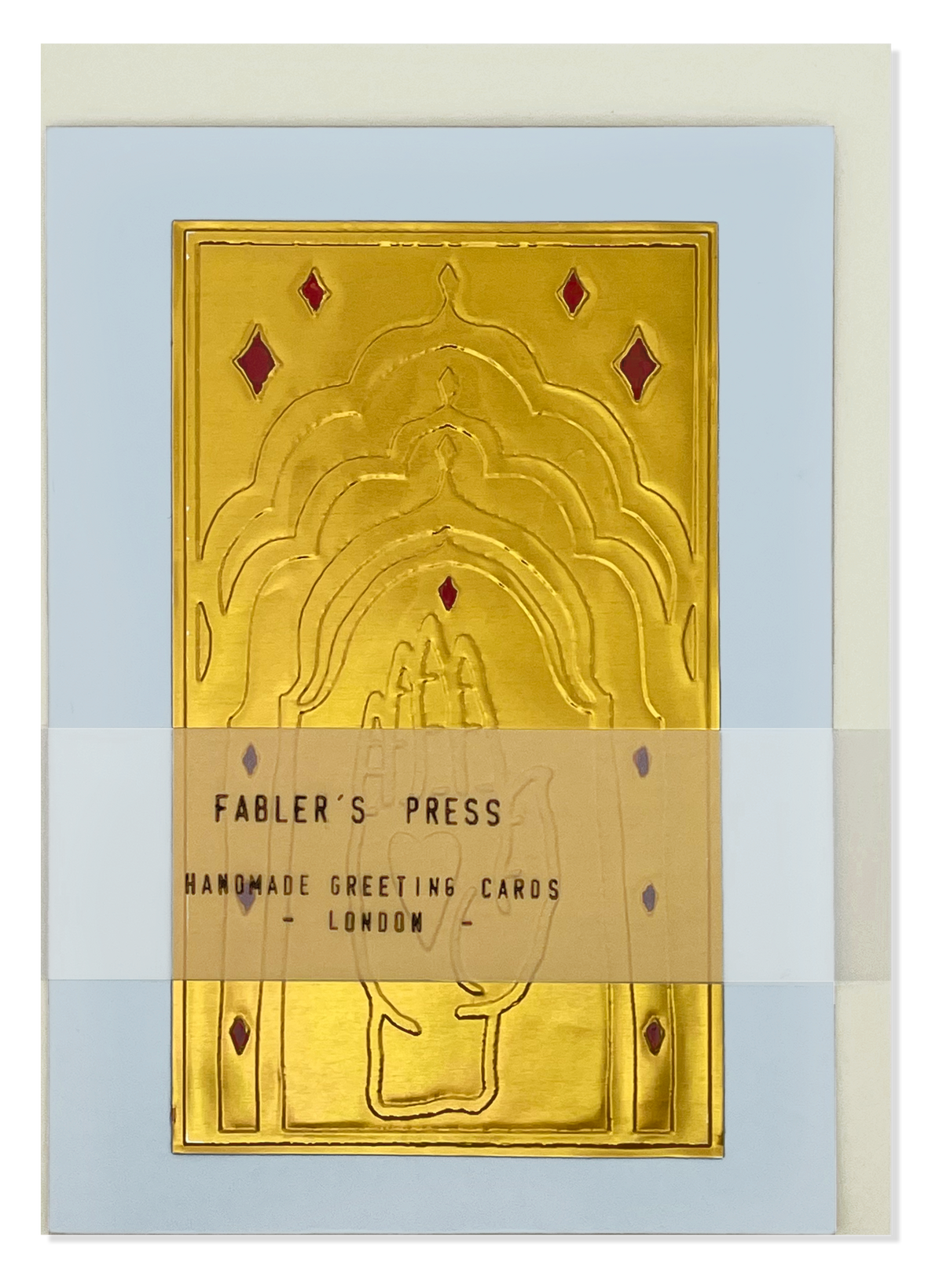 A handmade greeting card from Fabler's Press featuring an embossed hand design on a blue card stock background, wrapped with a translucent band labeled 'FABLER'S PRESS HANDMADE GREETING CARDS LONDON'.
