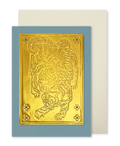 A greeting card by fabler's Press with a raised gold tiger design on a muted blue cardstock, shown with a plain off-white envelope behind it on a white background.